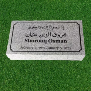 flat gray granite cemetery headstone