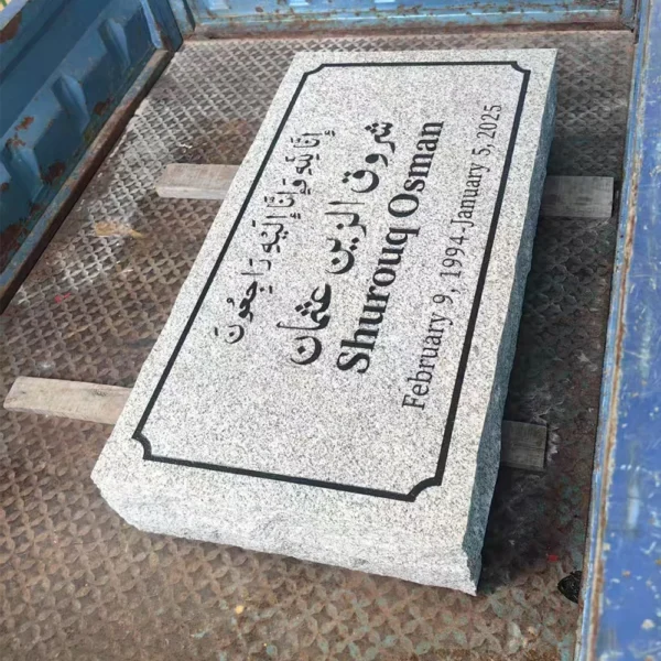single gray granite grave marker